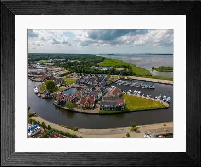 Framed Print : Aerial drone photo of the dutch town Huizen in Utrecht. It has a large marina with typical dutch houses Framed Print : Aerial drone photo of the dutch town Huizen in Utrecht. It has a large marina with typical dutch houses