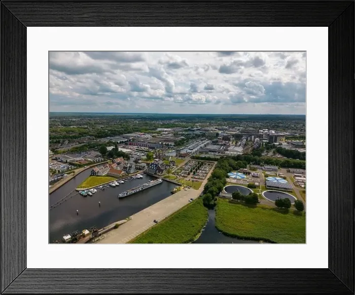 Framed Print : Aerial drone photo of the dutch town Huizen in Utrecht. It has a large marina with typical dutch houses Framed Print : Aerial drone photo of the dutch town Huizen in Utrecht. It has a large marina with typical dutch houses