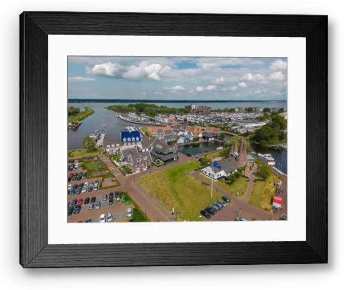 Framed Print : Aerial drone photo of the dutch town Huizen in Utrecht. It has a large marina with typical dutch houses Framed Print : Aerial drone photo of the dutch town Huizen in Utrecht. It has a large marina with typical dutch houses