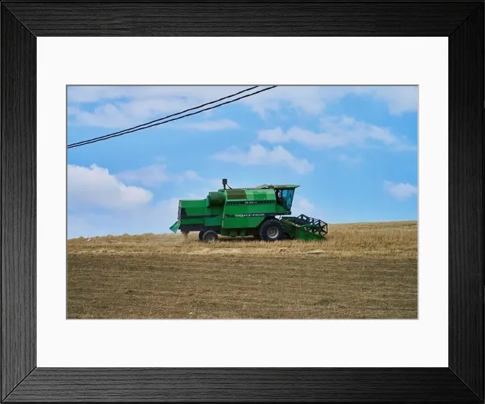 Framed Print : combine harvester working on a field Framed Print : combine harvester working on a field