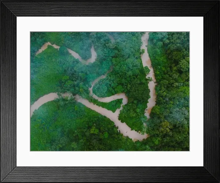 Framed Print : Aerial view of narrow road going through green trees growing in forest located at Amazonas rural area Framed Print : Aerial view of narrow road going through green trees growing in forest located at Amazonas rural area