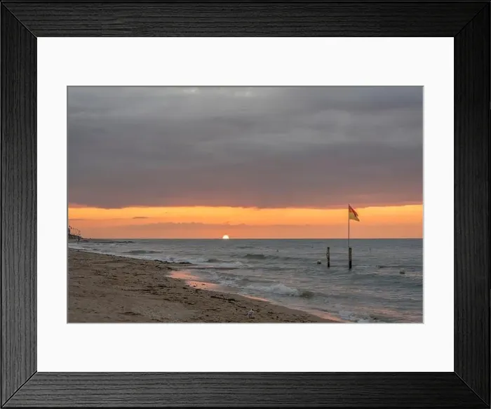 Framed Print : View of the sea and the jetty from the beach at sunset Framed Print : View of the sea and the jetty from the beach at sunset