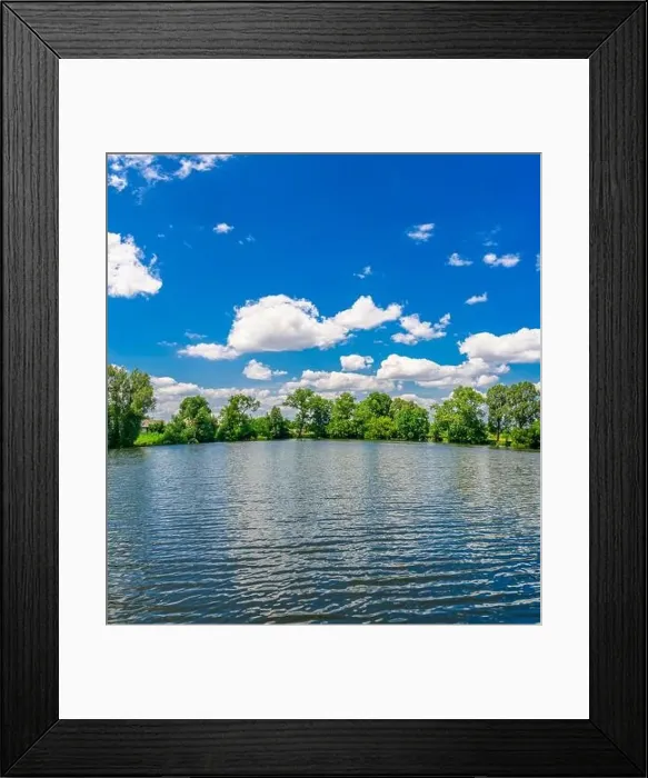 Framed Print : A small flat lake against the sky with clouds. Trees on the shore of the reservoir. Summer holidays, fishing Framed Print : A small flat lake against the sky with clouds. Trees on the shore of the reservoir. Summer holidays, fishing