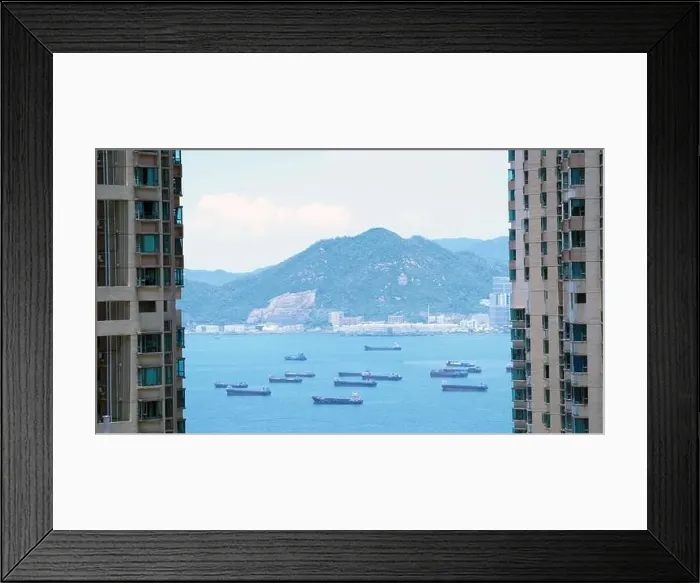 Framed Print : the empty container ships park near the Kwai Tsing port between building Framed Print : the empty container ships park near the Kwai Tsing port between building