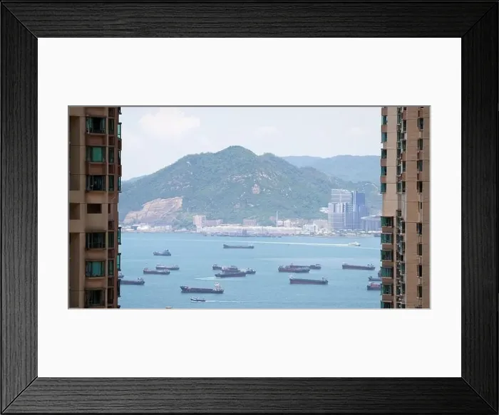 Framed Print : the empty container ships park near the Kwai Tsing port between building Framed Print : the empty container ships park near the Kwai Tsing port between building