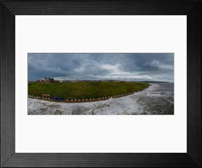 Framed Print : An aerial view of the colourful beach huts along the sea front in Whitby, North Yorkshire, UK Framed Print : An aerial view of the colourful beach huts along the sea front in Whitby, North Yorkshire, UK