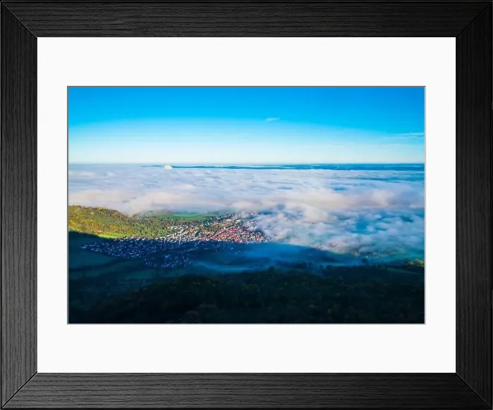 Framed Print : Germany, Bissingen an der teck village houses aerial panorama drone view above buildings under foggy ocean of clouds Framed Print : Germany, Bissingen an der teck village houses aerial panorama drone view above buildings under foggy ocean of clouds