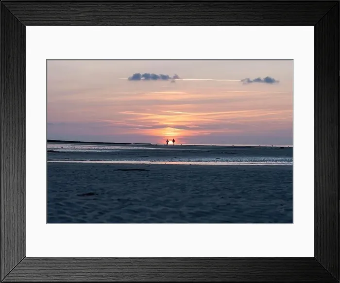 Framed Print : Langrune-Sur-Mer, France - 07 21 2023: View a man and a woman looking at the sunset on the beach Framed Print : Langrune-Sur-Mer, France - 07 21 2023: View a man and a woman looking at the sunset on the beach
