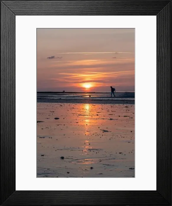 Framed Print : Langrune-Sur-Mer, France - 07 21 2023: View of a man and a couple walking on the beach Framed Print : Langrune-Sur-Mer, France - 07 21 2023: View of a man and a couple walking on the beach
