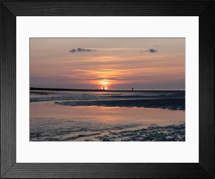 Framed Print : Langrune-Sur-Mer, France - 07 21 2023: View a man and a woman looking at the sunset on the beach Framed Print : Langrune-Sur-Mer, France - 07 21 2023: View a man and a woman looking at the sunset on the beach