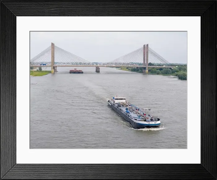 Framed Print : Aerial drone photo of a cargo ship on the river Waal in the Netherlands Framed Print : Aerial drone photo of a cargo ship on the river Waal in the Netherlands