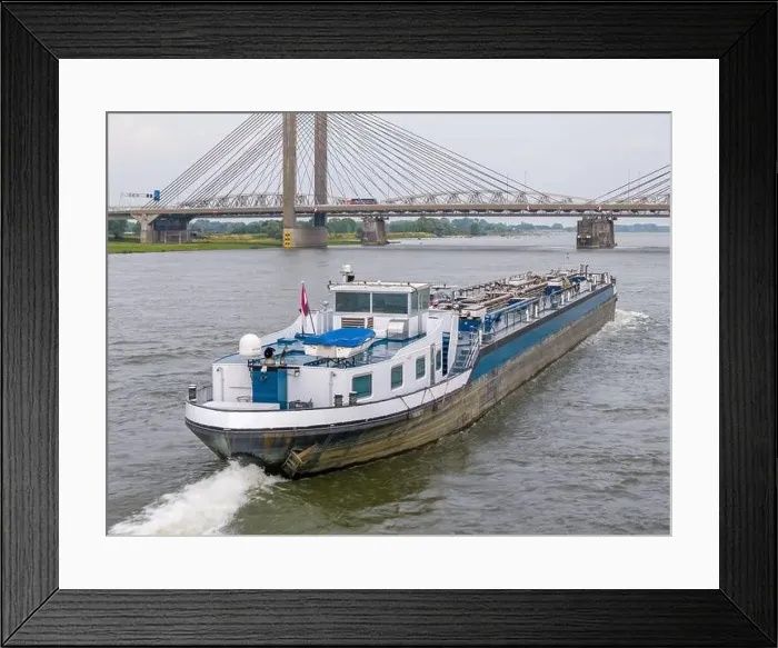 Framed Print : Aerial drone photo of a cargo ship on the river Waal in the Netherlands Framed Print : Aerial drone photo of a cargo ship on the river Waal in the Netherlands