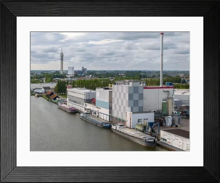 Framed Print : Aerial drone photo of a cargo barge docked at an industrial zone in Wormerveer, the Netherlands Framed Print : Aerial drone photo of a cargo barge docked at an industrial zone in Wormerveer, the Netherlands