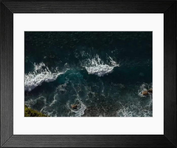 Framed Print : Great waves in the Atlantic Ocean that are illuminated by the sun and therefore shine so beautifully