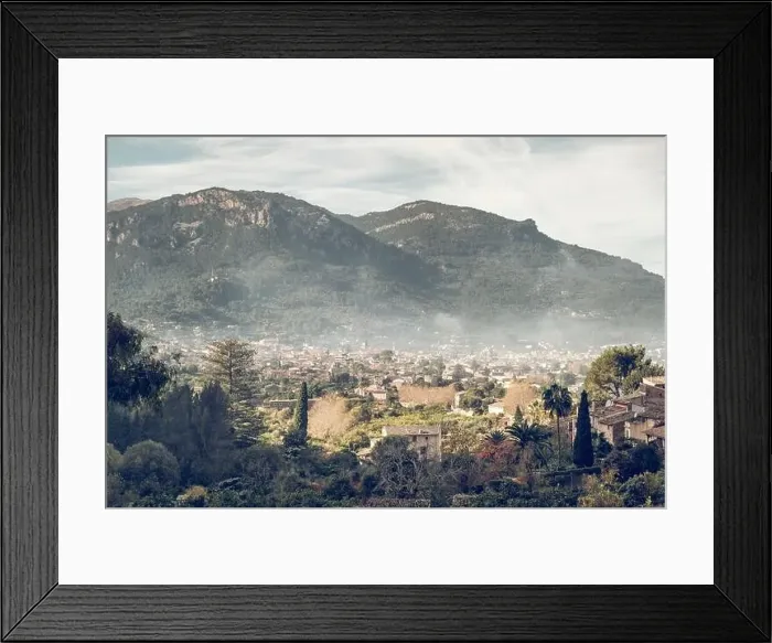 Framed Print : Aerial view of old town located near mountain ridge on cloudy day in green countryside of Mallorca Framed Print : Aerial view of old town located near mountain ridge on cloudy day in green countryside of Mallorca