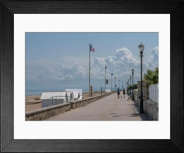 Framed Print : Saint-Aubin-Sur-Mer, France - 07 25 2023: A man and a woman with a white dog are running on the jetty next to the beach Framed Print : Saint-Aubin-Sur-Mer, France - 07 25 2023: A man and a woman with a white dog are running on the jetty next to the beach