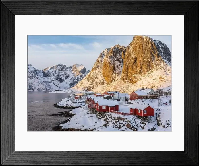 Framed Print : Spectacular aerial view of illuminated by sunlight small houses located on snowy seashore against rocky mountains in Framed Print : Spectacular aerial view of illuminated by sunlight small houses located on snowy seashore against rocky mountains in