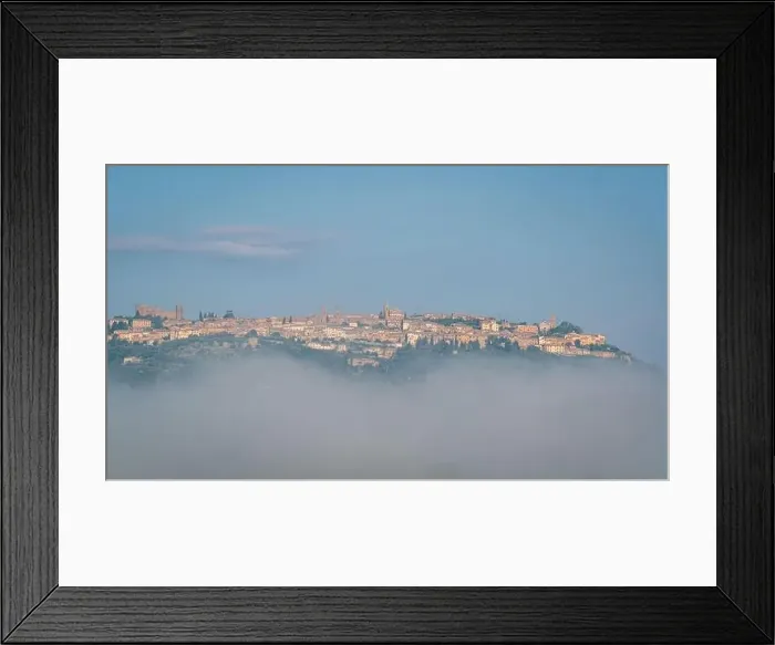 Framed Print : Panoramic view of city Montalcino beyond the morning clouds Framed Print : Panoramic view of city Montalcino beyond the morning clouds