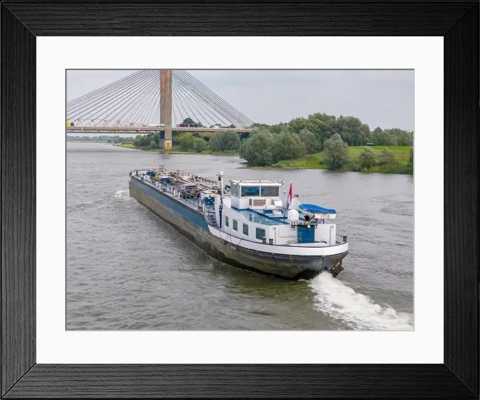 Framed Print : Aerial drone photo of a large cargo barge sailing on the river Waal in the Netherlans Framed Print : Aerial drone photo of a large cargo barge sailing on the river Waal in the Netherlans