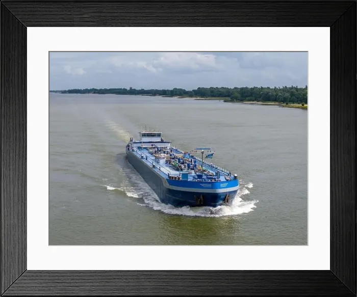 Framed Print : Aerial drone photo of a large cargo barge sailing on the river Waal in the Netherlans Framed Print : Aerial drone photo of a large cargo barge sailing on the river Waal in the Netherlans