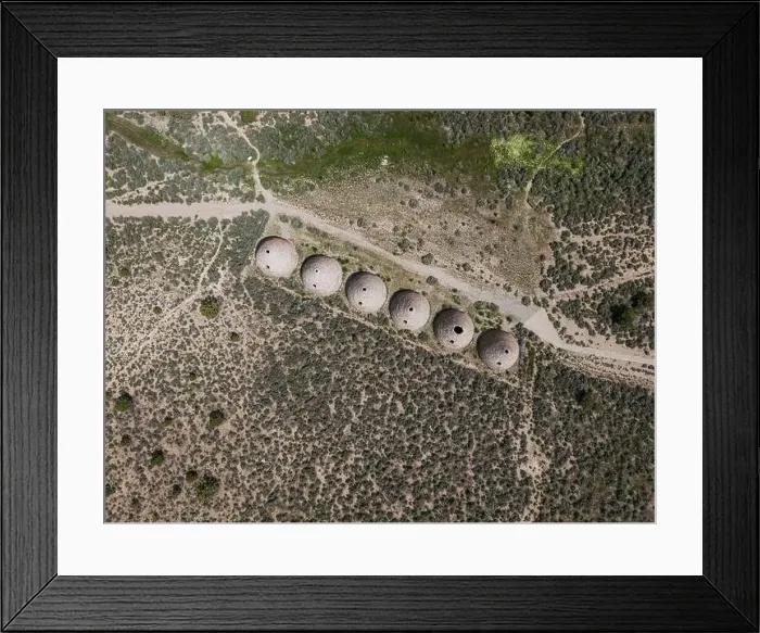 Framed Print : Aerial perspective of the behave shaped charcoal ovens that were used from 1876 to 1897 to make charcoal out of trees Framed Print : Aerial perspective of the behave shaped charcoal ovens that were used from 1876 to 1897 to make charcoal out of trees