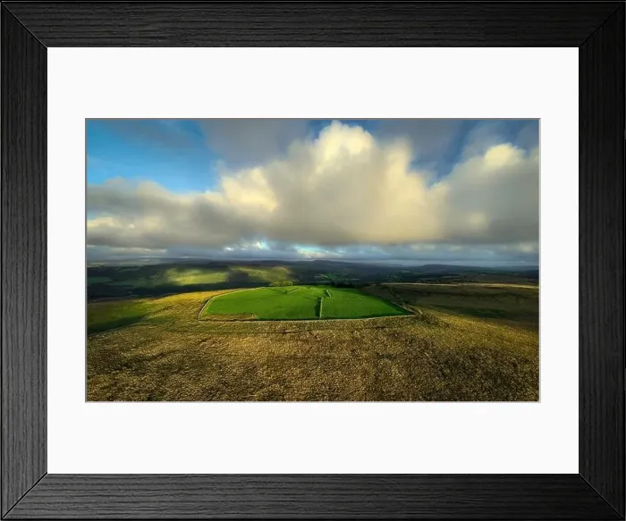 Framed Print : A green field light by evening light on the Gwrhyd mountain in the Brecon Beacons, South Wales UK