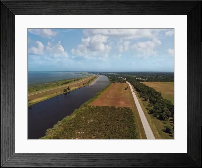 Framed Print : Lake Okeechobee scenic trail, canal and country road. Aerial view Framed Print : Lake Okeechobee scenic trail, canal and country road. Aerial view