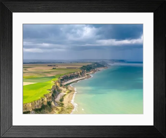 Framed Print : Aerial view of the beautiful coastline near Arromanches in Normandy, France. High cliffs rise above the sea