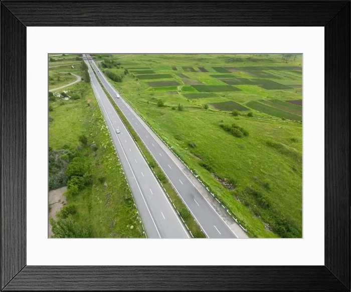 Framed Print : Aerial view of highway with car Framed Print : Aerial view of highway with car