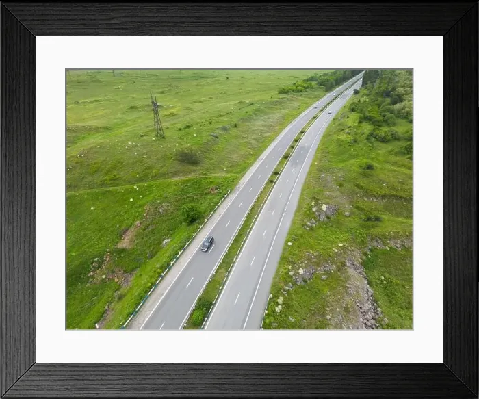 Framed Print : Aerial view of highway with car Framed Print : Aerial view of highway with car