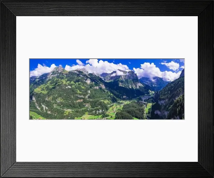 Framed Print : Swiss nature scenery. Kandersteg village with stunning valley surrouded by high Alps mountains Framed Print : Swiss nature scenery. Kandersteg village with stunning valley surrouded by high Alps mountains