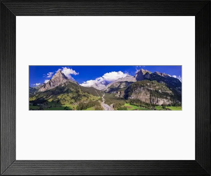 Framed Print : Swiss nature scenery. Kandersteg village with stunning valley surrouded by high Alps mountains Framed Print : Swiss nature scenery. Kandersteg village with stunning valley surrouded by high Alps mountains