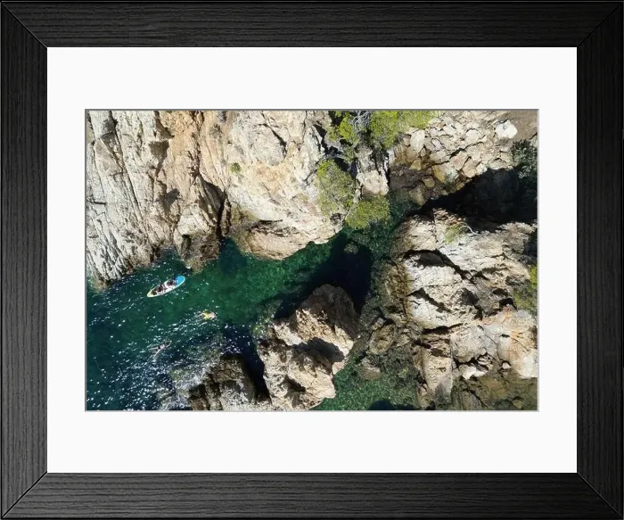 Framed Print : Drone photo looking down on swimmers in a rocky Cove in the South of France Framed Print : Drone photo looking down on swimmers in a rocky Cove in the South of France
