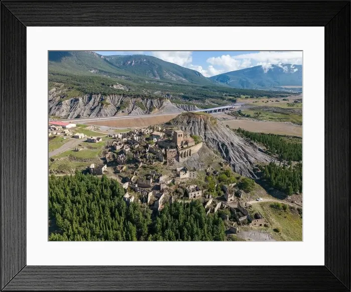 Framed Print : Aerial drone photo of the abandoned ghost town named Esco. Esco is located next to lake Aragon in Northern Spain Framed Print : Aerial drone photo of the abandoned ghost town named Esco. Esco is located next to lake Aragon in Northern Spain