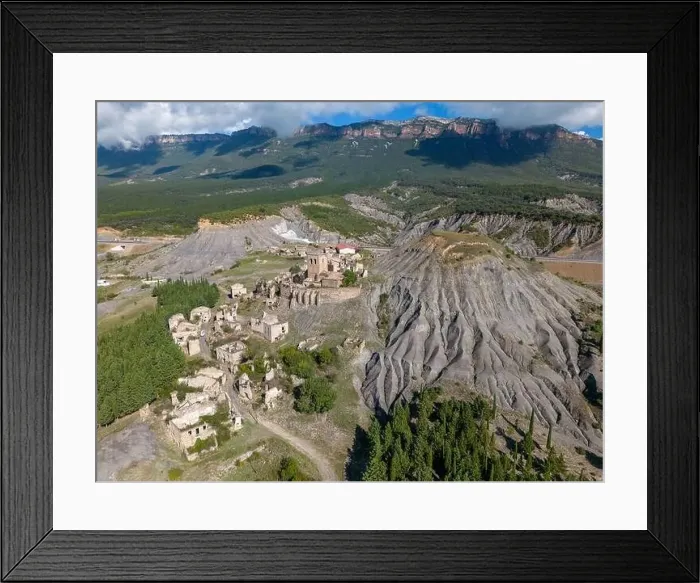 Framed Print : Aerial drone photo of the abandoned ghost town named Esco. Esco is located next to lake Aragon in Northern Spain Framed Print : Aerial drone photo of the abandoned ghost town named Esco. Esco is located next to lake Aragon in Northern Spain