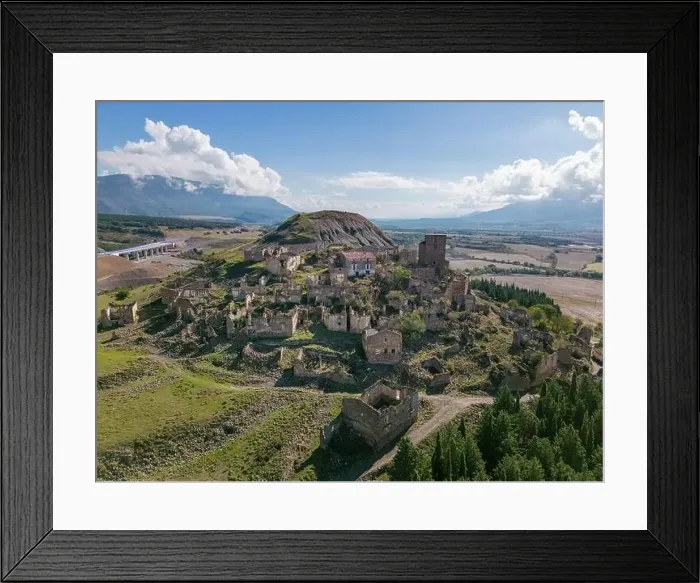 Framed Print : Aerial drone photo of the abandoned ghost town named Esco. Esco is located next to lake Aragon in Northern Spain Framed Print : Aerial drone photo of the abandoned ghost town named Esco. Esco is located next to lake Aragon in Northern Spain