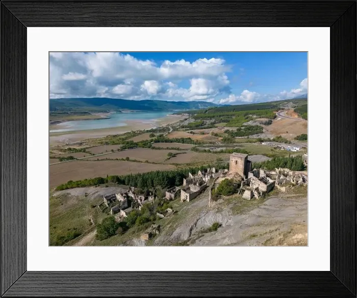 Framed Print : Aerial drone photo of the abandoned ghost town named Esco. Esco is located next to lake Aragon in Northern Spain Framed Print : Aerial drone photo of the abandoned ghost town named Esco. Esco is located next to lake Aragon in Northern Spain