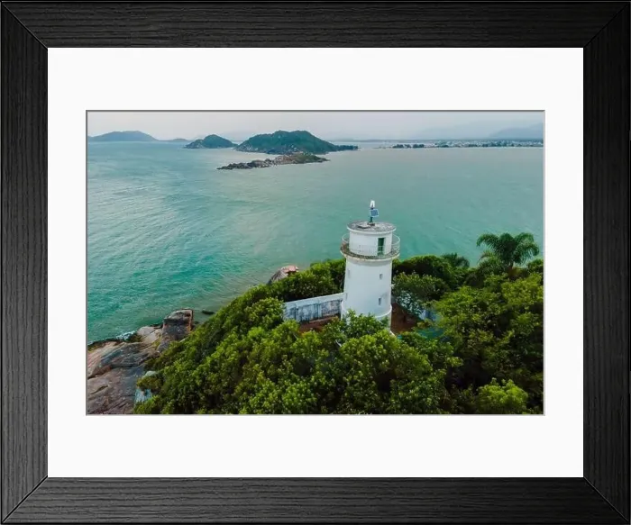 Framed Print : Aerial view of scenic coastline with lighthouse in Santa Catarina, Brazil Framed Print : Aerial view of scenic coastline with lighthouse in Santa Catarina, Brazil