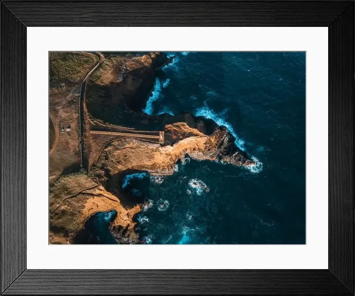 Framed Print : Aerial view of the coasts and cliffs of the island of Sao Miguel over the lighthouse of Farolim dos Fenais da Ajuda Framed Print : Aerial view of the coasts and cliffs of the island of Sao Miguel over the lighthouse of Farolim dos Fenais da Ajuda