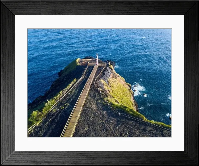Framed Print : Aerial view of Farolim dos Fenais da Ajuda lighthouse on a cliff Framed Print : Aerial view of Farolim dos Fenais da Ajuda lighthouse on a cliff
