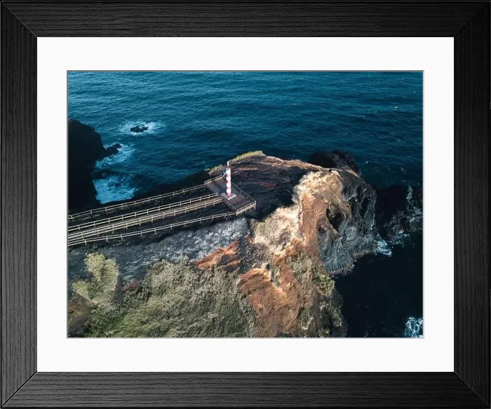 Framed Print : Aerial view of Farolim dos Fenais da Ajuda lighthouse on a cliff Framed Print : Aerial view of Farolim dos Fenais da Ajuda lighthouse on a cliff