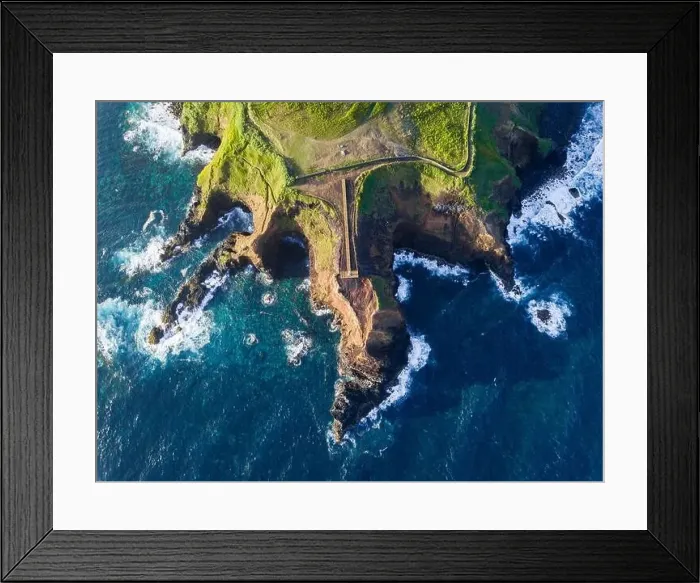 Framed Print : Aerial view of the coasts and cliffs of the island of Sao Miguel over the lighthouse of Farolim dos Fenais da Ajuda Framed Print : Aerial view of the coasts and cliffs of the island of Sao Miguel over the lighthouse of Farolim dos Fenais da Ajuda