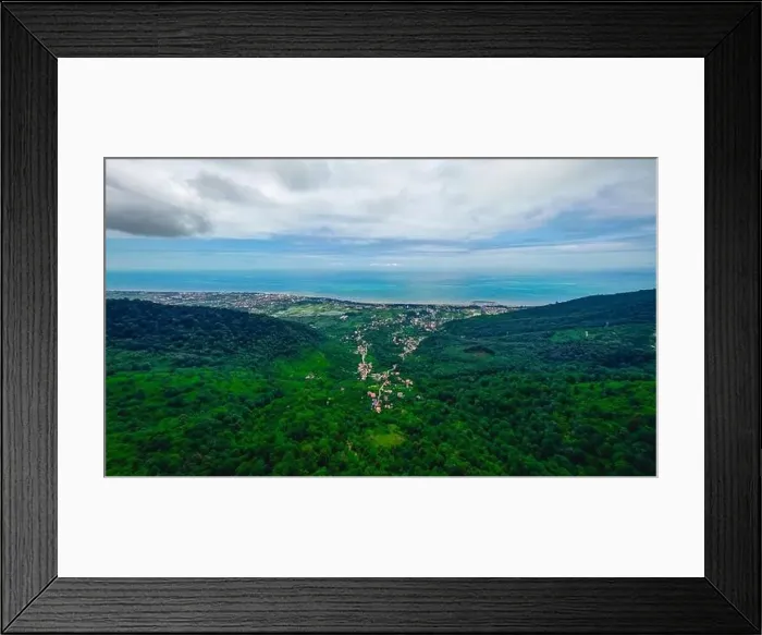 Framed Print : aerial photo of forest, sea and cloudy sky Framed Print : aerial photo of forest, sea and cloudy sky