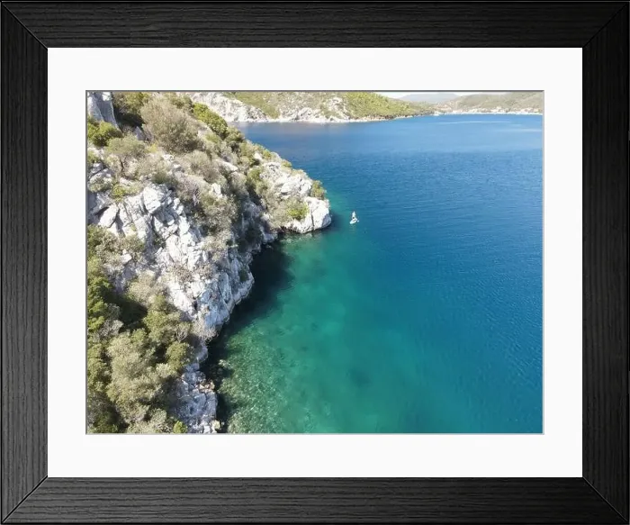 Framed Print : Panoramic drone photo of the tropical beach and a SUP paddleboard in the bay of Toroni in Halkidiki, Greece Framed Print : Panoramic drone photo of the tropical beach and a SUP paddleboard in the bay of Toroni in Halkidiki, Greece