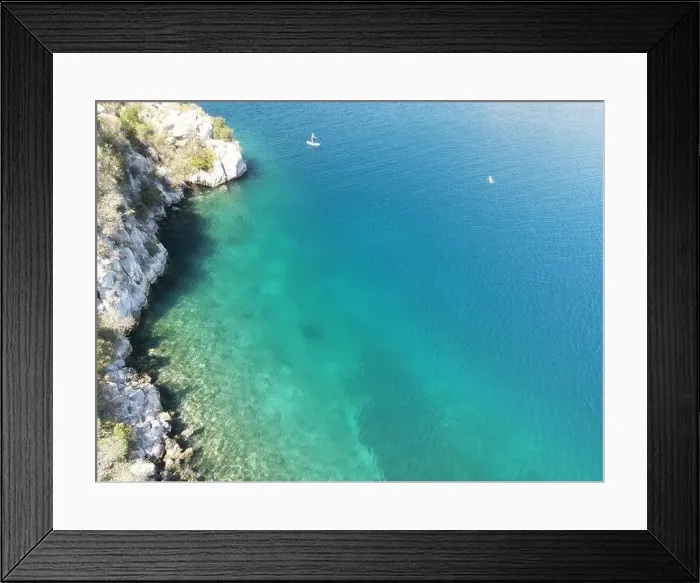 Framed Print : Panoramic drone photo of the tropical beach and a SUP paddleboard in the bay of Toroni in Halkidiki, Greece Framed Print : Panoramic drone photo of the tropical beach and a SUP paddleboard in the bay of Toroni in Halkidiki, Greece