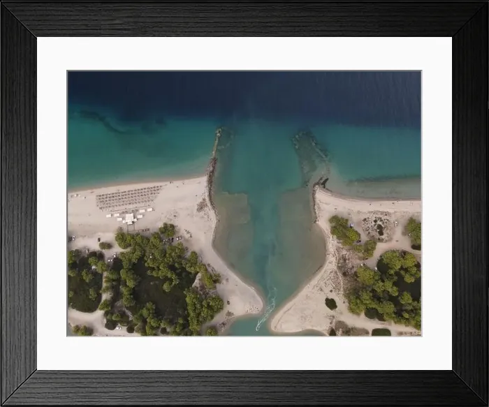 Framed Print : Overhead drone photo over the tropical blue ocean and the bay of Glarokavos in Paliouri, Halkidiki, Greece Framed Print : Overhead drone photo over the tropical blue ocean and the bay of Glarokavos in Paliouri, Halkidiki, Greece
