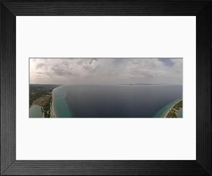 Framed Print : Overhead drone photo over the tropical blue ocean and the bay of Glarokavos in Paliouri, Halkidiki, Greece Framed Print : Overhead drone photo over the tropical blue ocean and the bay of Glarokavos in Paliouri, Halkidiki, Greece