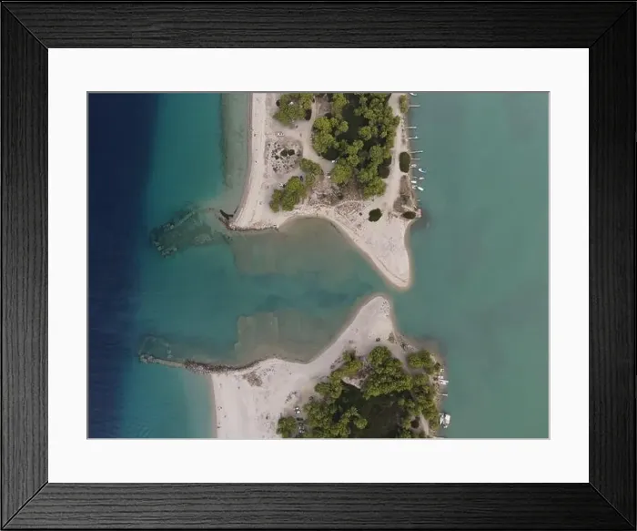 Framed Print : Overhead drone photo over the tropical blue ocean and the bay of Glarokavos in Paliouri, Halkidiki, Greece Framed Print : Overhead drone photo over the tropical blue ocean and the bay of Glarokavos in Paliouri, Halkidiki, Greece