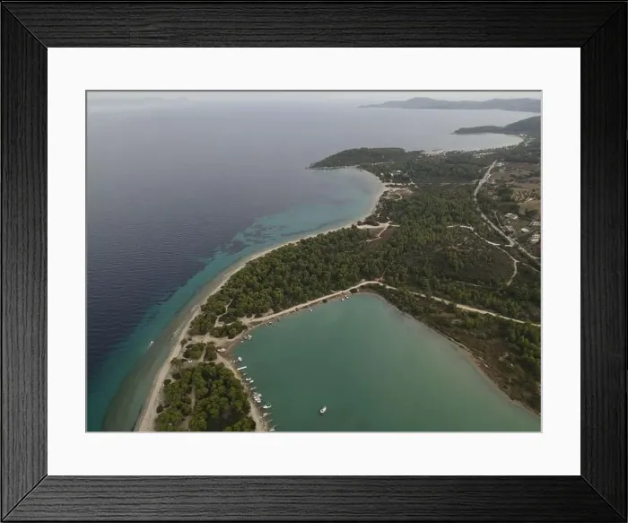 Framed Print : Overhead drone photo over the tropical blue ocean and the bay of Glarokavos in Paliouri, Halkidiki, Greece Framed Print : Overhead drone photo over the tropical blue ocean and the bay of Glarokavos in Paliouri, Halkidiki, Greece