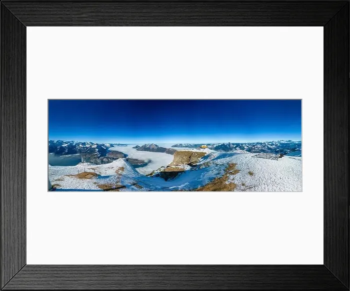 Framed Print : Aerial drone view of snow covered mountains and ski slopes, ski area Stoos, Switzerland Framed Print : Aerial drone view of snow covered mountains and ski slopes, ski area Stoos, Switzerland